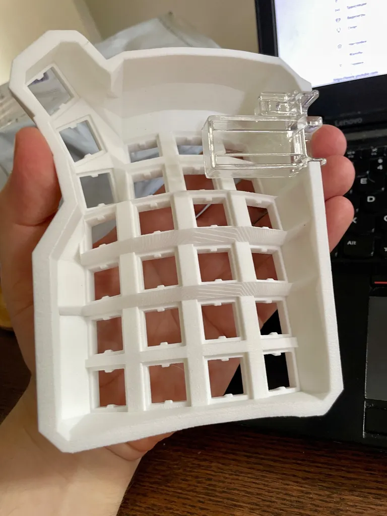 Holding the half from below, with the clear SLA resin controller holder clipped onto the edge